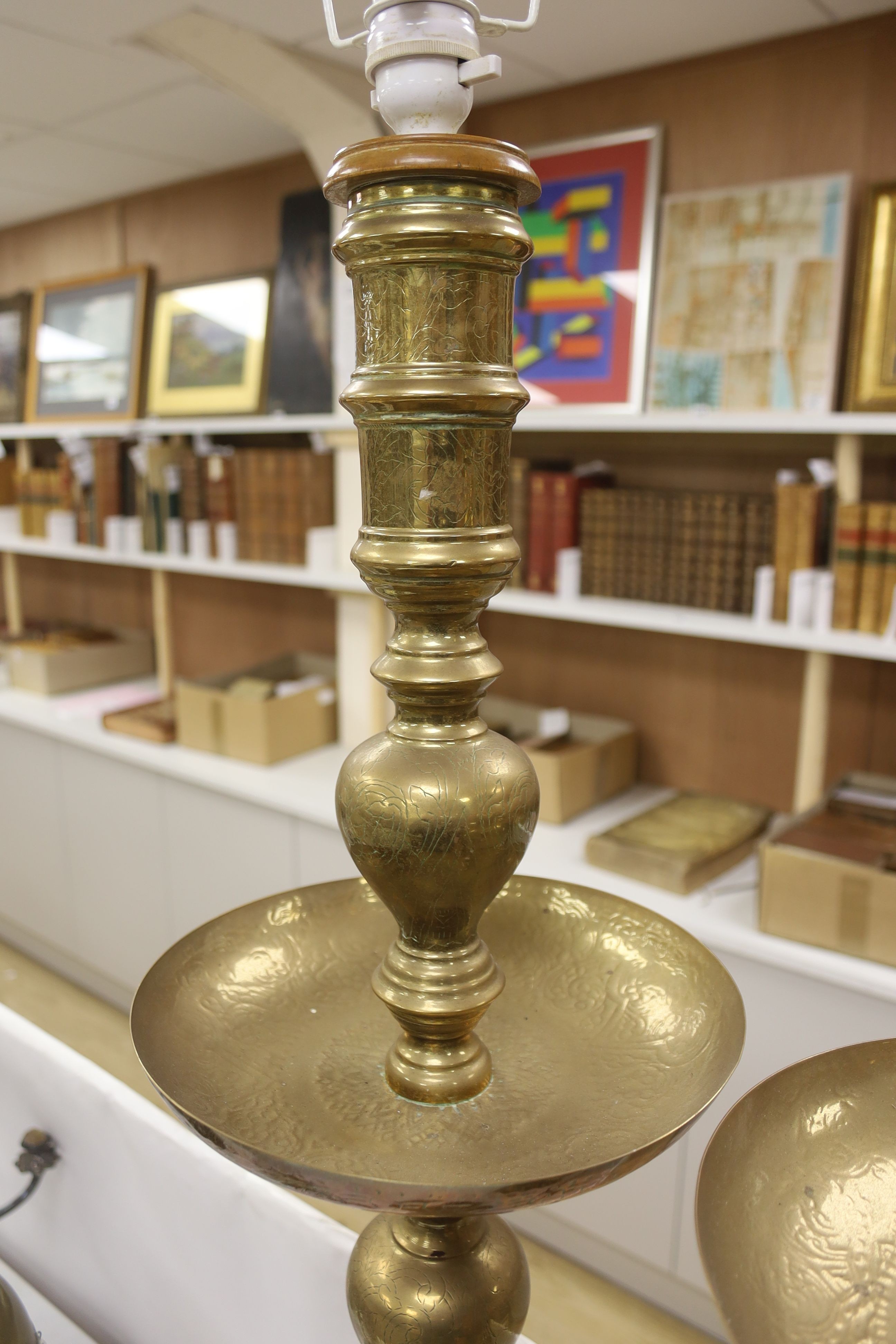 A pair of Benares engraved brass floor lamps 89cm